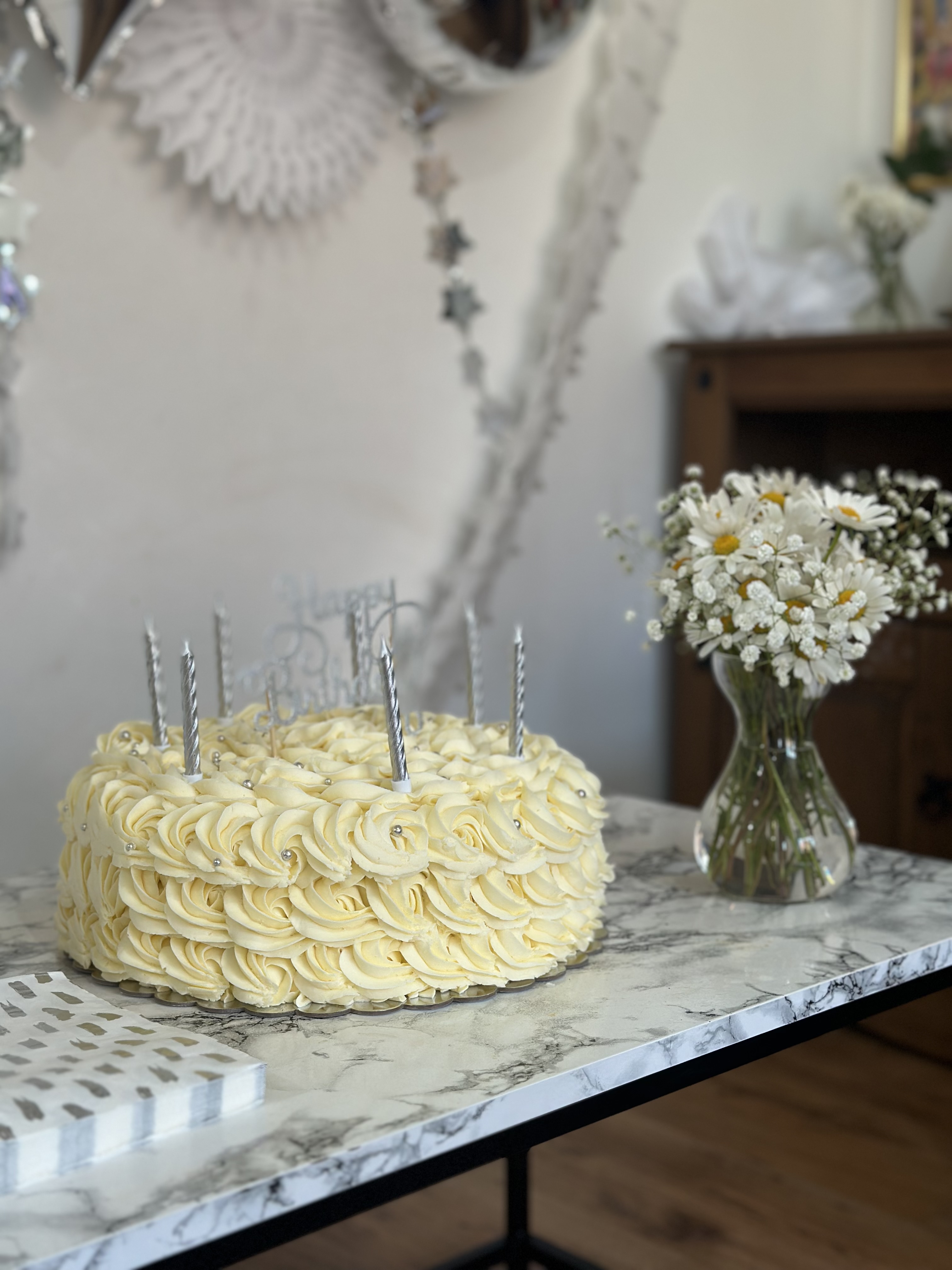 Elegant homemade celebration cake displayed inside Stokers