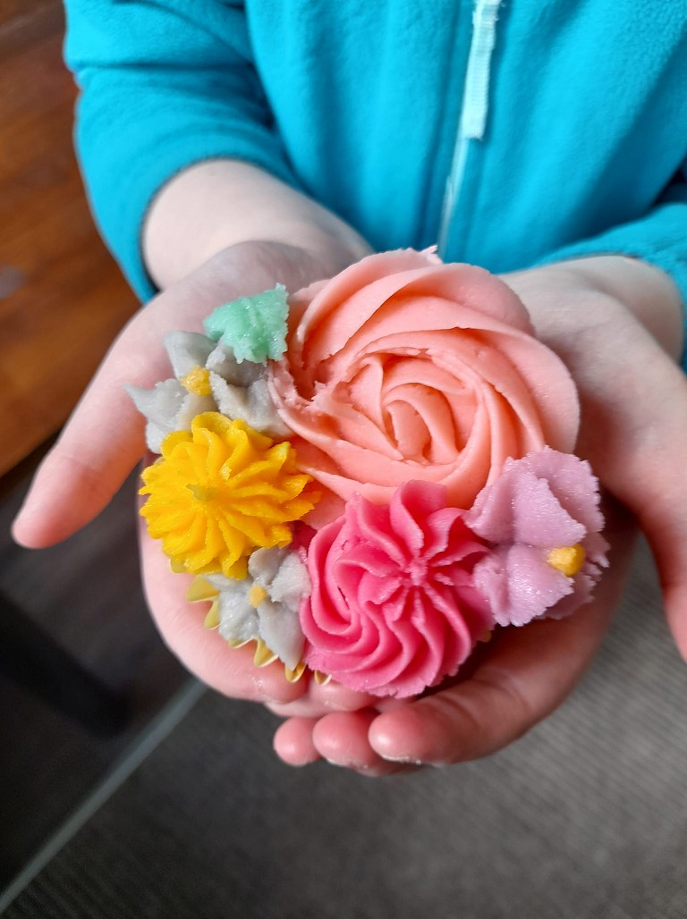 Colourful hand-decorated cupcakes